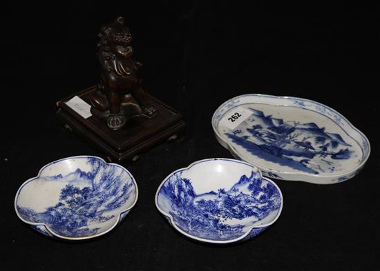 A Japanese figure of Shi-Shi and three blue and white dishes
